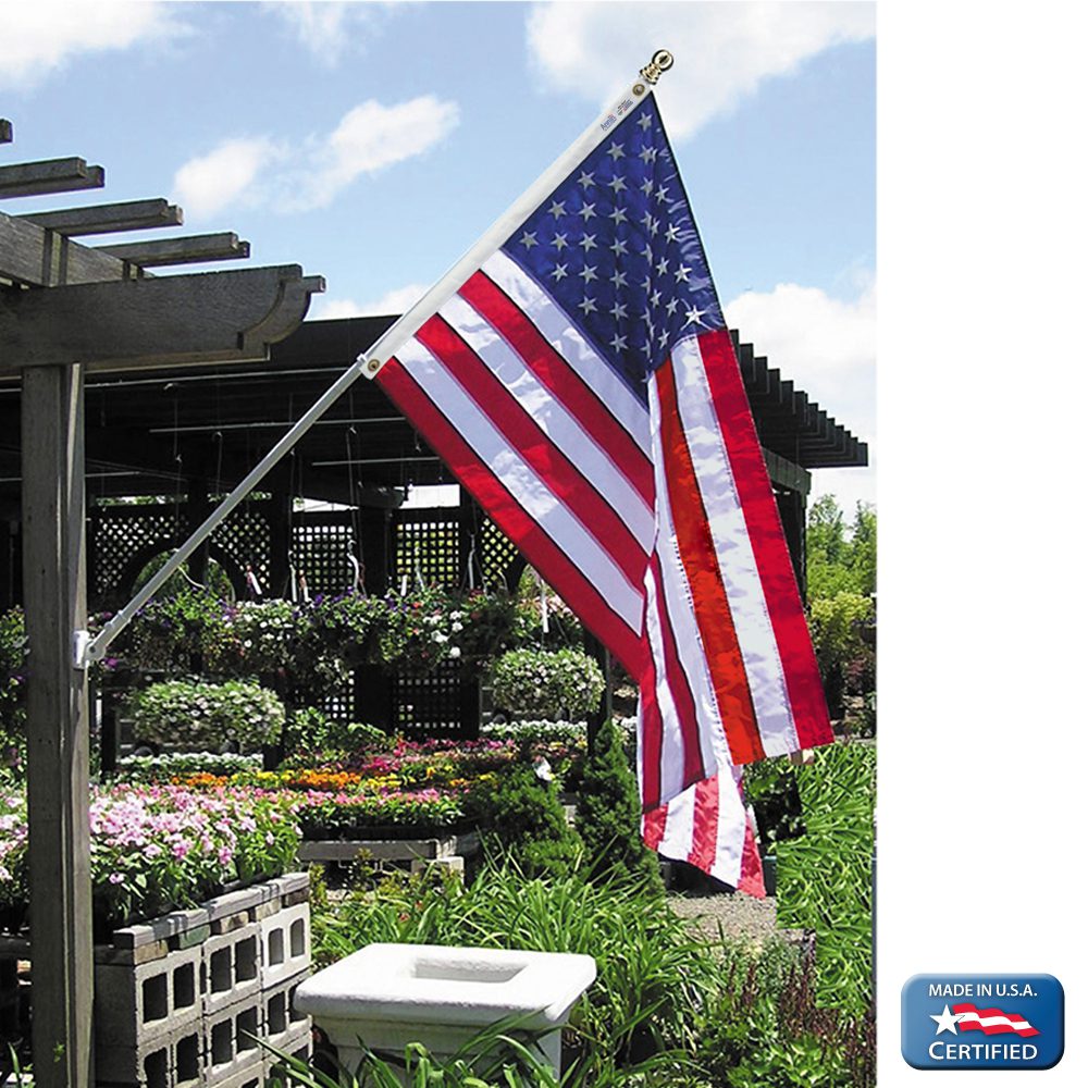 American flag displayed in a garden setting.